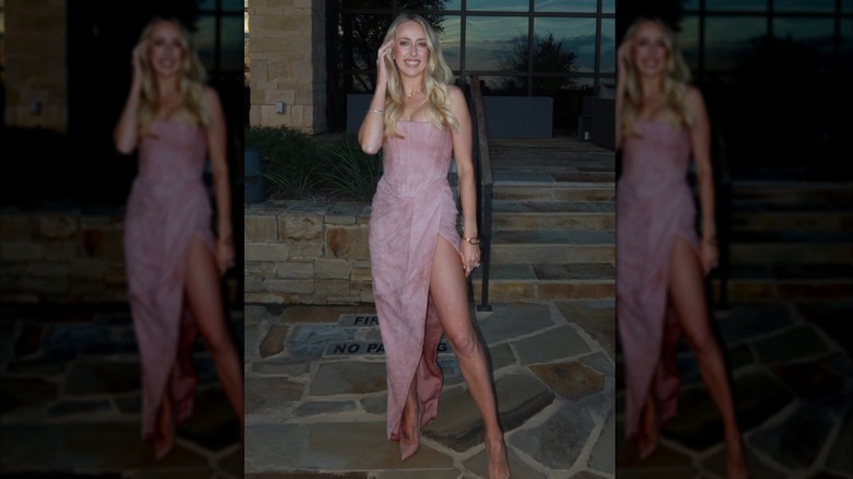 Brittany Mahomes poses in a light pink dress at a friend's wedding.