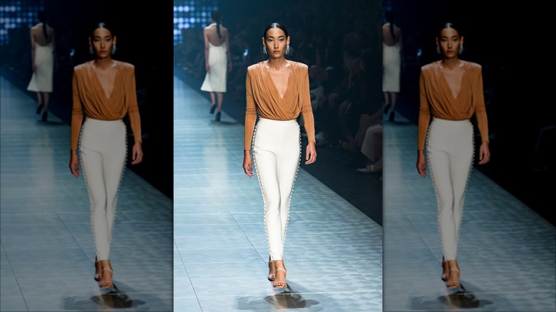 Model on runway caramel brown shirt