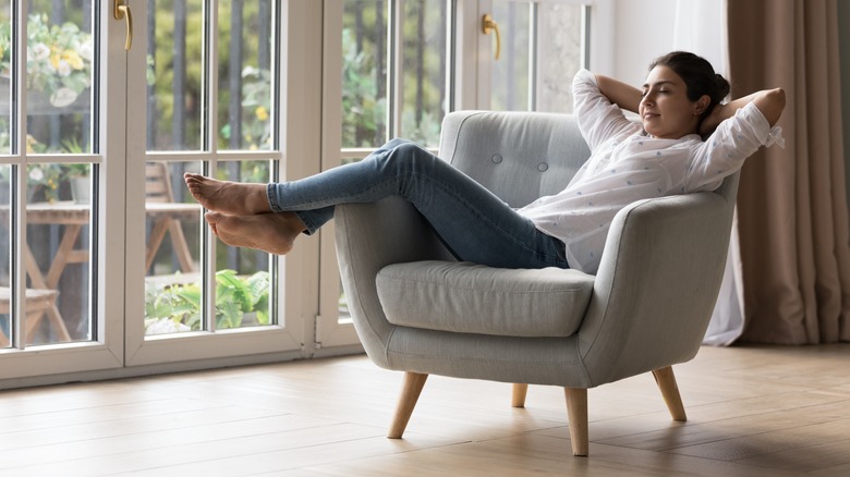 woman lounging in chair