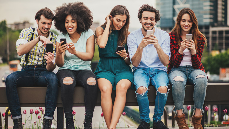 group of friends with phones