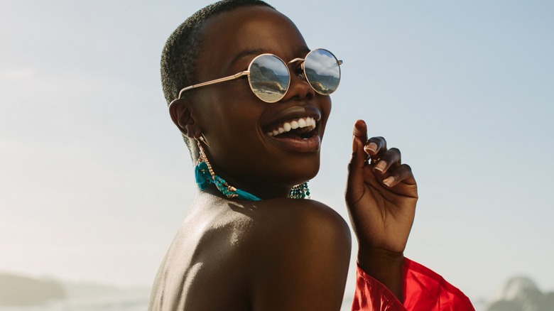 Smiling woman in sunglasses