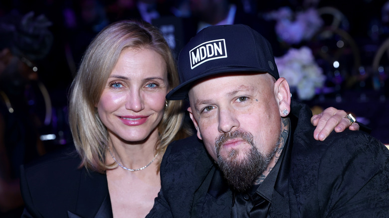 Cameron Diaz placing a hand on Benji Madden's shoulder at the Michael Rubin REFORM Alliance Casino Night