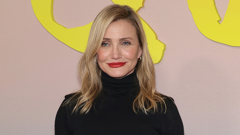 Cameron Diaz wearing a black dress at the world premiere of Apple's 