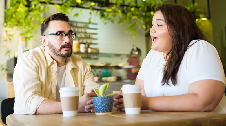 annoyed man and happy woman