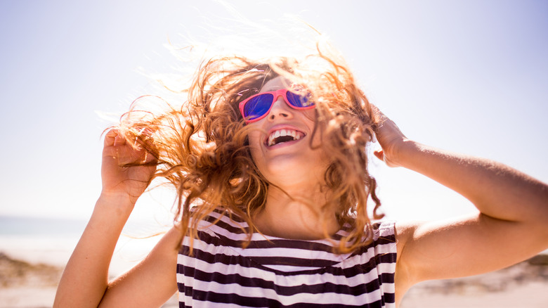 Woman frolics in sun