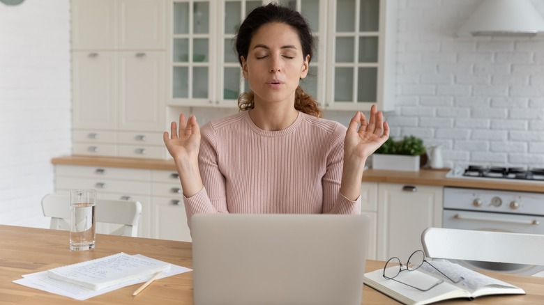 woman meditating at desk