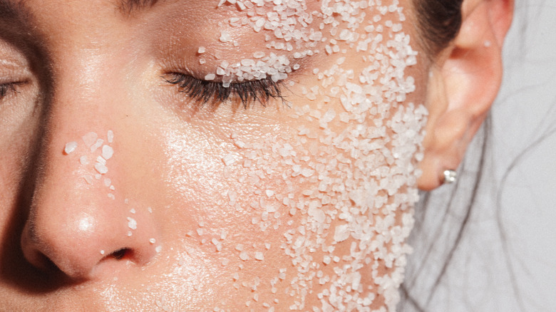 Woman with sea salt scrub on face