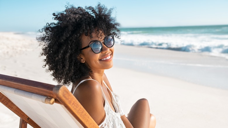 woman sitting on beach 