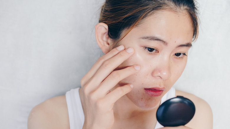 Woman looking at under-eye area