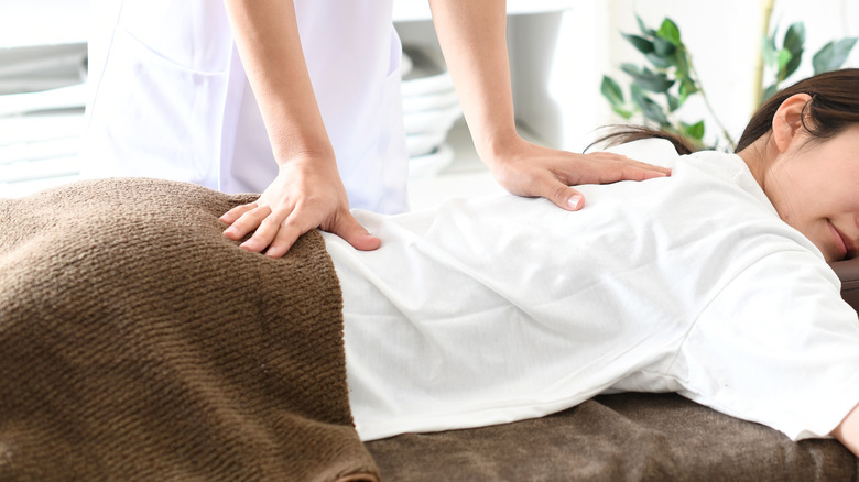 woman lying on treatment table