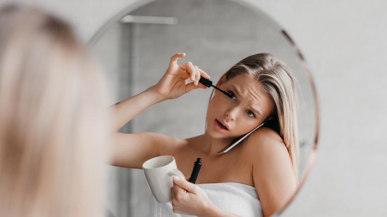 Woman doing her makeup