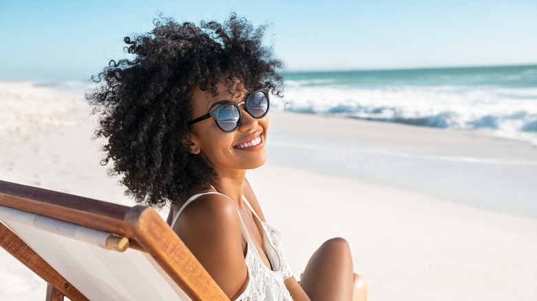 Woman on beach smiling