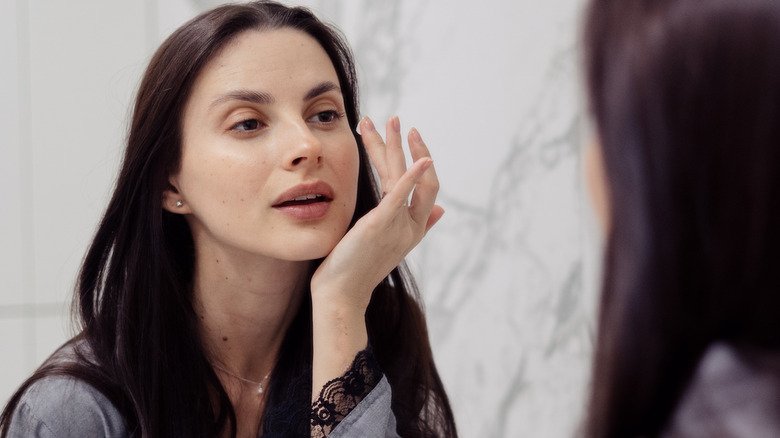 woman applying undereye cream