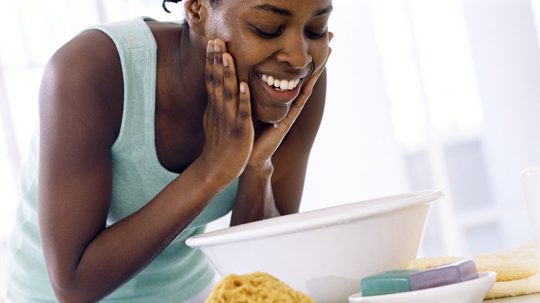 woman washing face