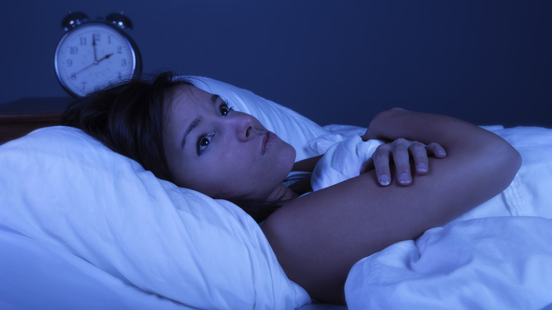woman awake in bed at night