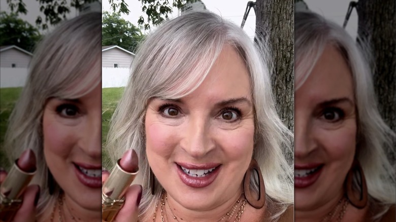 Woman with pink frosted lipstick