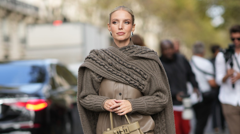 woman wearing cape top