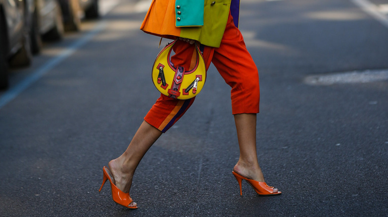 Woman in orange capri pants