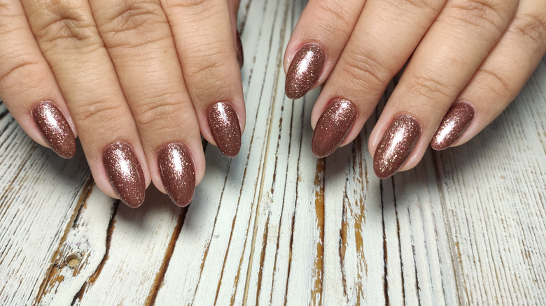 almond-shaped shimmery brown nails