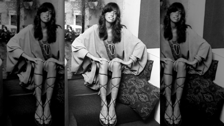 Carly Simon poses for a portrait in 1971 wearing lace-up gladiator style sandals
