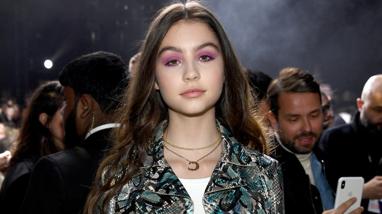 Carys Douglas wearing pink eyeshadow and a snakeskin jacket
