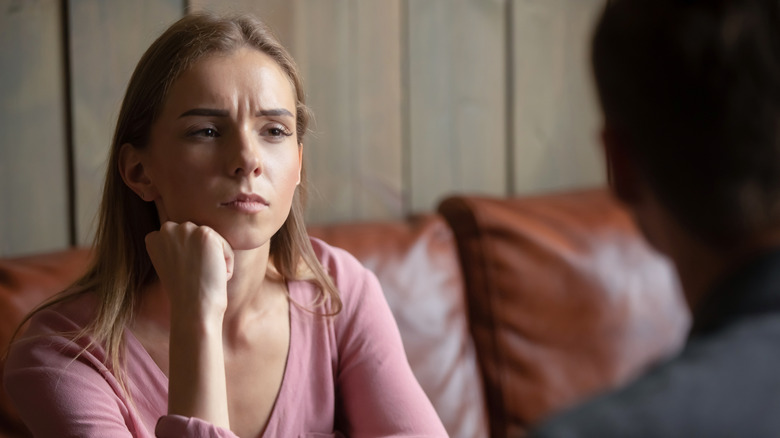 woman looking suspiciously at date