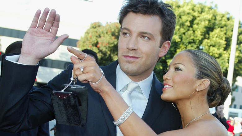 Jennifer Lopez pointing and Ben Affleck waving at the 2003 premiere of "Daredevil."