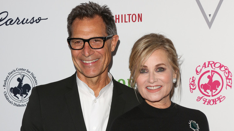 Actors Michael Cummings and Maureen McCormick smile for photos while  attending the 2018 Carousel Of Hope Ball