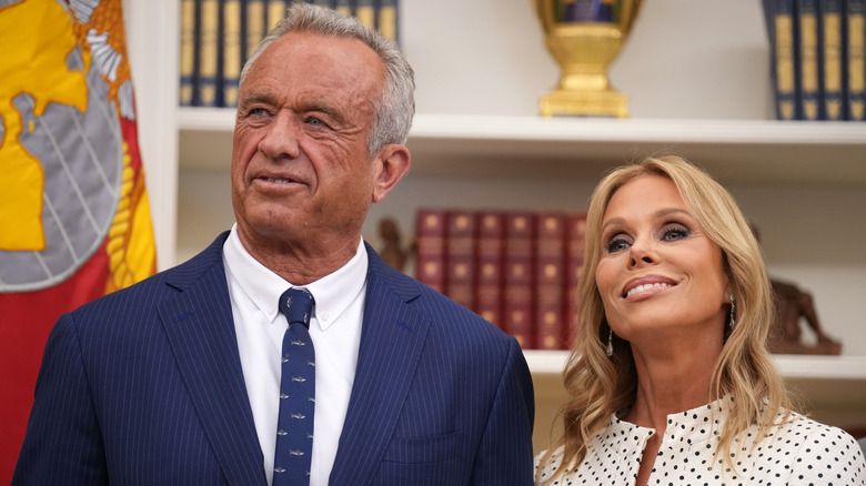Robert F Kennedy Jr stands in the oval office with Cheryl Hines