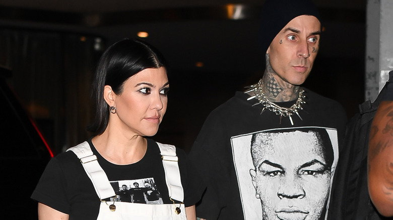 Kourtney Kardashian Barker and Travis Barker walking together