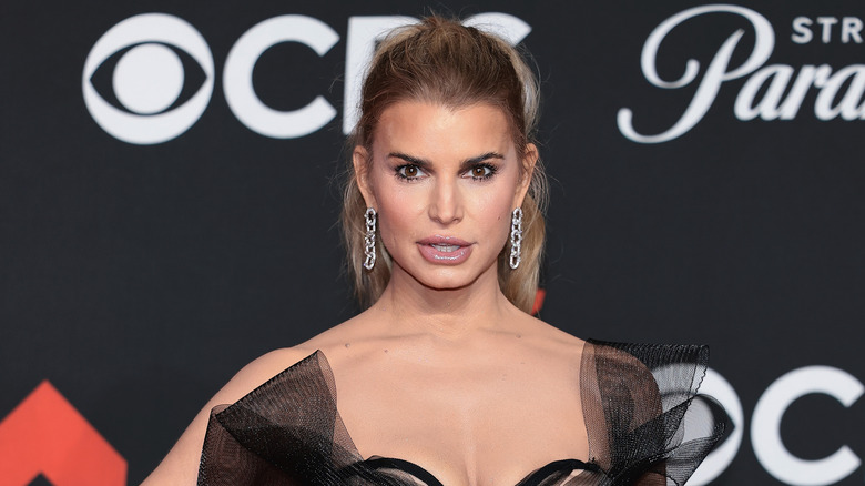 Jessica Simpson posing in a black dress