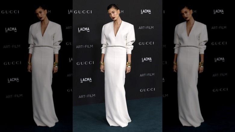 Hailey Bieber posing in a white dress at the LACMA Art+Film Gala