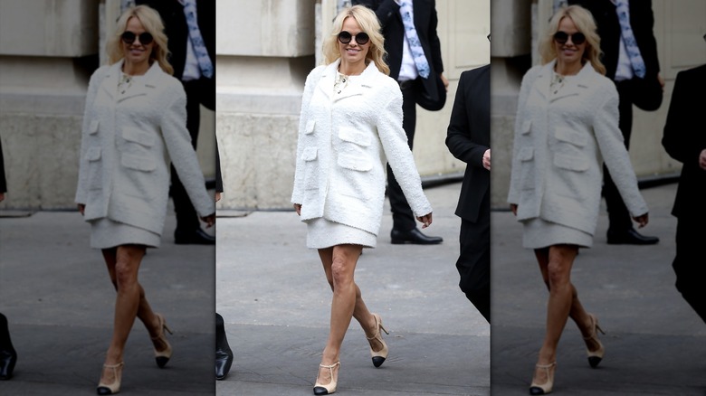 Pamela Anderson wearing a white tweed blazer and skirt in Paris