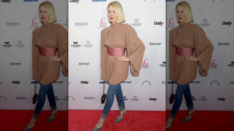Naomi Watts wearing a mini dress over skinny jeans at the Fashion Media Awards in September 2026
