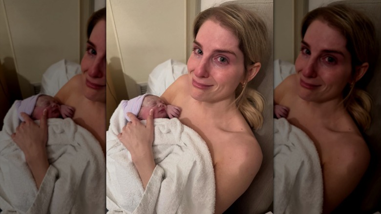 Meghan Trainor posing with her baby Mikey