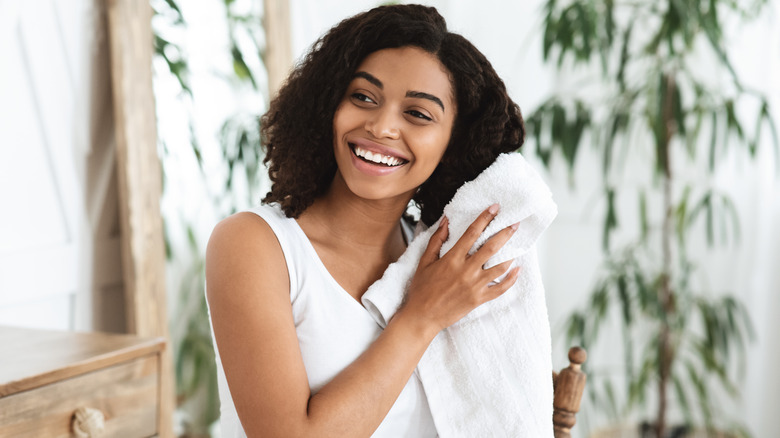 woman towel-drying hair