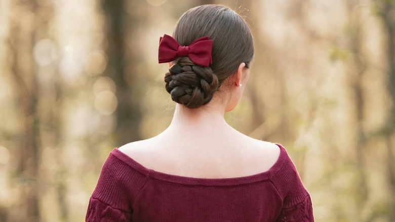 Low bun with red hair bow