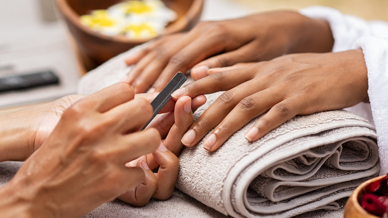 A woman getting a manicure