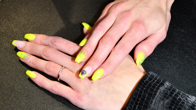 yellow nails with charms