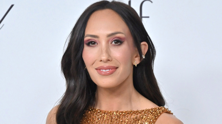Cheryl Burke posing on the red carpet in 2025