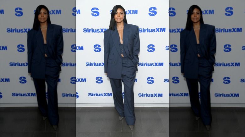 Gabrielle Union poses in a blue three-piece suit