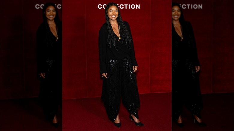 Gabrielle Union in a black jacket and flowy pants