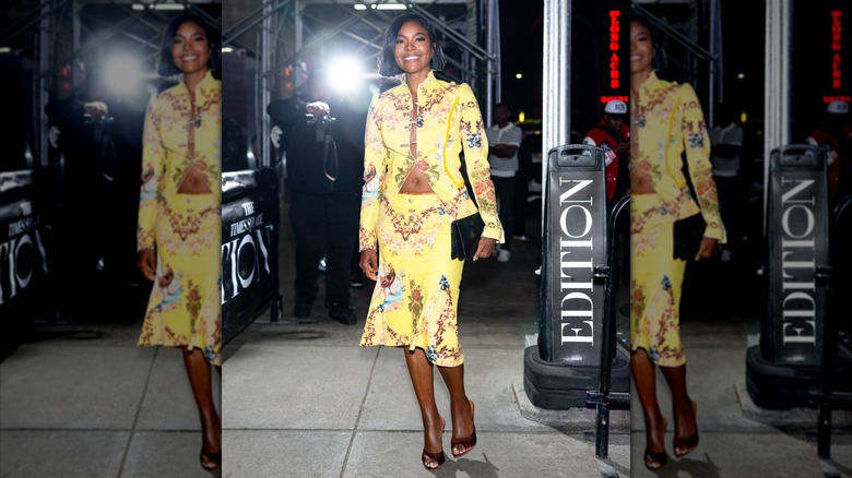 Gabrielle Union in a yellow jacket and skirt