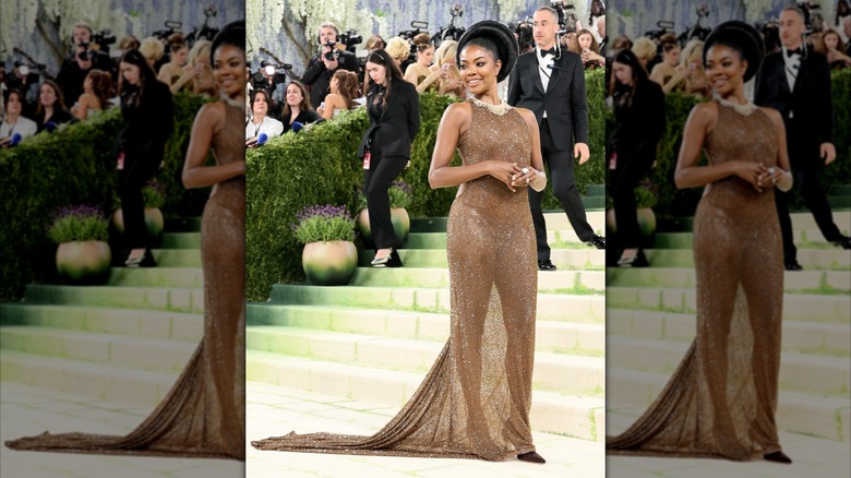 Gabrielle Union smiles in a brown sparkly dress