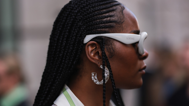 woman wearing clear chunky hoops