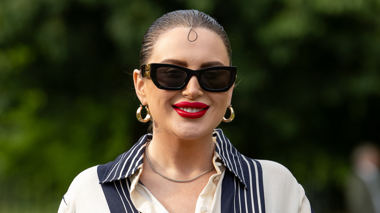 Girl wearing gold hoops.