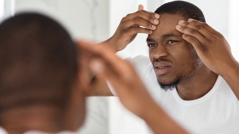 man looking in the mirror