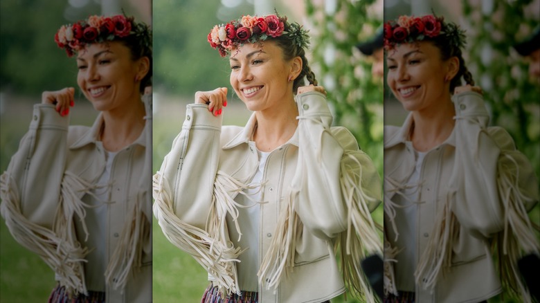 woman in white fringe jacket