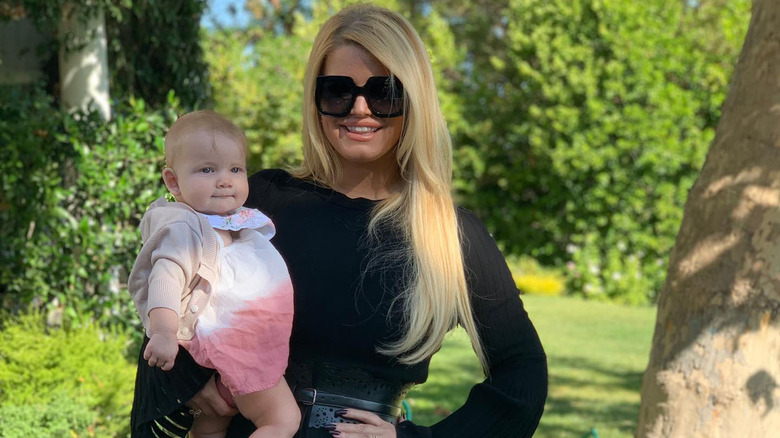 Jessica Simpson holding baby