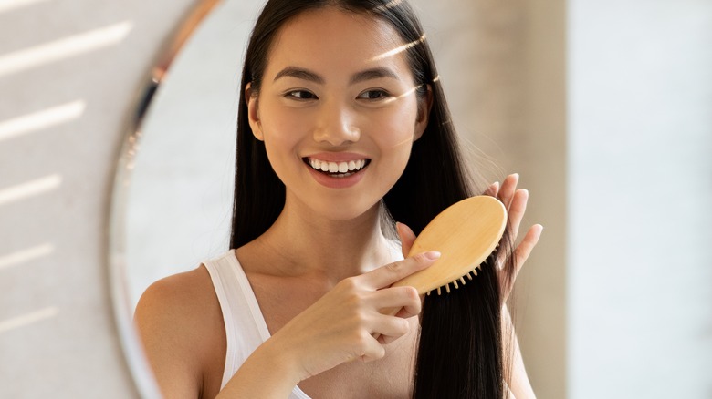 female brushing hair